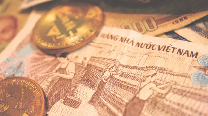 Close up the Vietnamese Dong Banknotes and Bitcoin