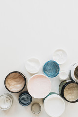 Healthcare, spa, beauty collage with cream assortment on white background. Flat lay, top view skin care concept.