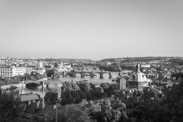 Panoramic view of Charles Bridge in Prague in a beautiful summer day, travel concept, 2019. Black and white Czech Republic