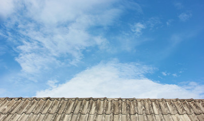 roof tiles and​ blue​ sky.​ pattern​s​ of​ blue​ sky​ with​ cloud​ and​ roof​ tiles.