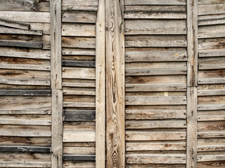 Fence made of old nailed pallet planks - wooden texture