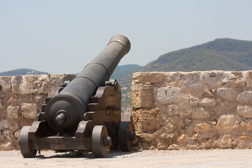Fototapeta na wymiar old cannon elevated on castle wall