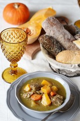 thick soup with pumpkin and beef. hearty autumn dish