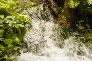 Waterfall water flow closeup, clear water descending from the mountains - Image