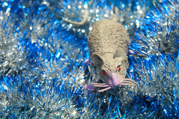 rat toy, silver color is in festive tinsel.