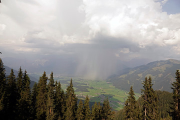 a storm with rain and hail is coming in the mountains