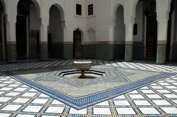 Obraz premium Marrakesh Morocco, interior courtyard with fountain and zellige tiled floor at Dar Si Said 