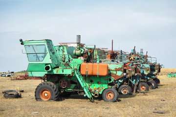 Obraz premium old rusty harvesters parked