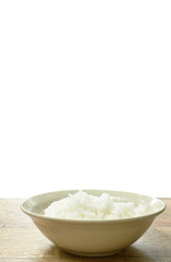 plain rice in bowl on table with white background