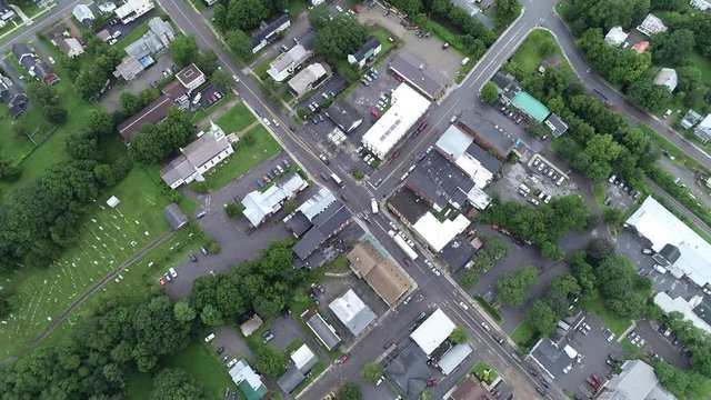 4K aerial establishing shot of the small American town of Waterbury, Vermont, in the Green Mountains, USA
