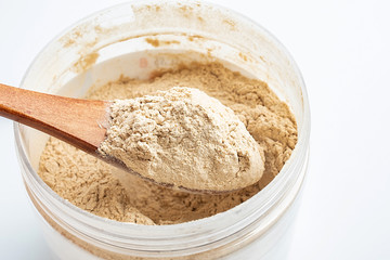 a jar of nutritious shrimp skin powder on a white background