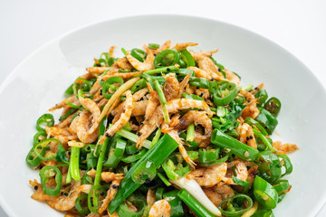 Chinese national dish, a plate of green pepper fried red shrimps on a white background