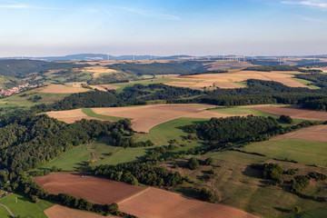 Aerial view at a landscape in Germany, Rhineland Palatinate near Bad Sobernheim with the river Nahe, meadow, farmland, forest, hills, mountains