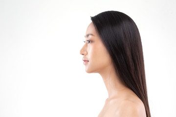 Naklejka premium Side view of Beautiful Asian woman smile with clean and fresh skin Happiness and cheerful with positive emotional,isolated on white background,Beauty and Cosmetics Concept