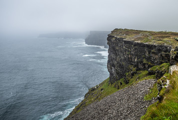 Fototapeta na wymiar Stormy day at Cliffs of Moher in Ireland