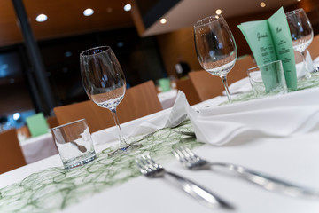 Elegant, luxury and romantic decorated dinner table with wine glasses and cutlery