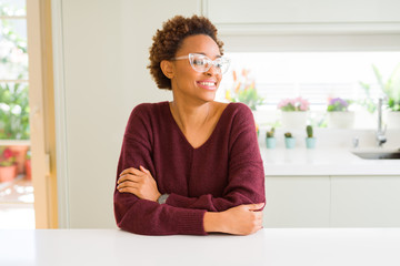 Beautiful young african woman with afro hair wearing glasses