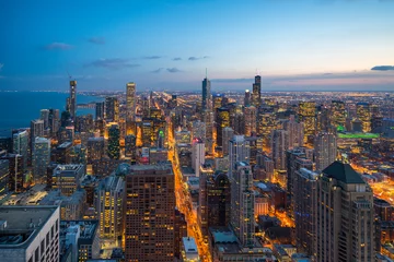 Tuinposter Beautiful scenic view of business district of Chicago loop with skyline in evening sunlight. Panoramic view aerial top view or drone architecture view of city. Famous attraction in Chicago, USA. © ChayTee