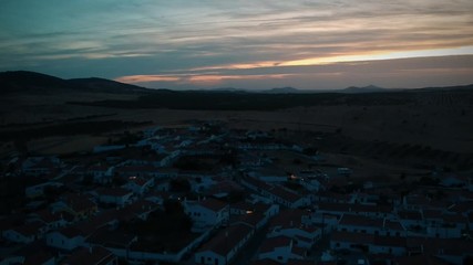 Aerial view from an amazing sunset in Alentejo, Portugal. With agricultural fields in background.