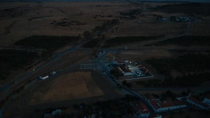 Aerial view from an amazing sunset in Alentejo, Portugal. With agricultural fields in background.