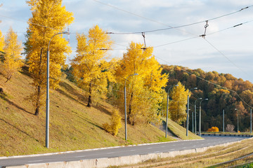Beautiful autumn cityscape, road to the bridge