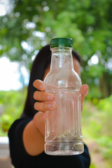 bottle of water in front of glass of water