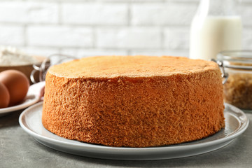 Delicious fresh homemade cake on light grey marble table