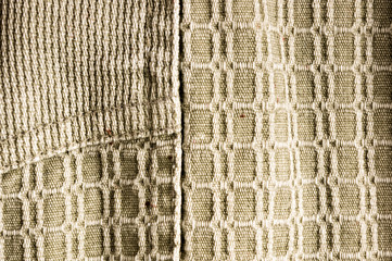 clothing items stonewashed cotton fabric texture with seams, clasps, buttons and rivets, macro