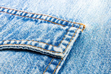 clothing items blue stonewashed faded jeans cotton fabric texture with seams, clasps, buttons and...