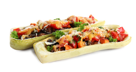 Delicious baked stuffed zucchini on white background
