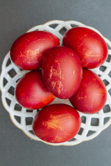 Dyed eggs in onion skins are at the plate