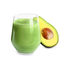 Glass of tasty smoothie and avocado on white background
