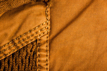 clothing items stonewashed cotton fabric texture with seams, clasps, buttons and rivets, macro