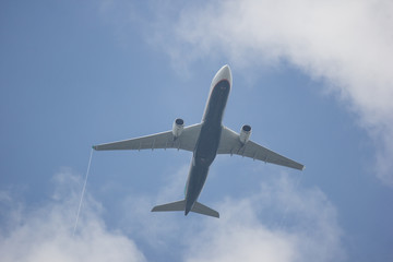 Airplane take off on blue sky with cloudy