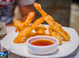 Typical Japanese dish of fried squid with sauce.