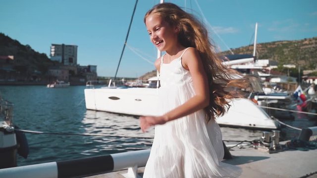 Preteen girl running near sea at summer