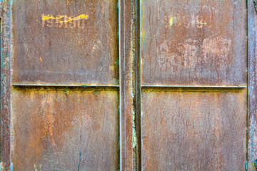 Detail of rusty corroded metal flat shutter or door. Metal texture background