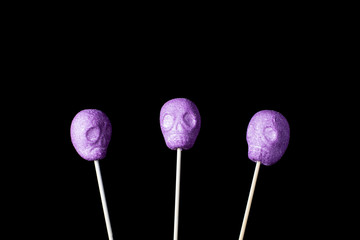 Various typical halloween sweets on a black background. Useful as a background for commercial purposes