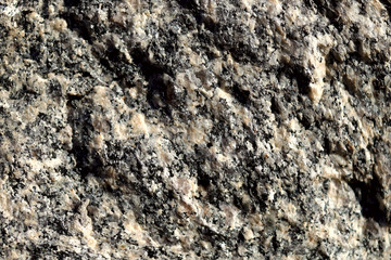 Abstract blurred natural background. Gray rough surface of granite. Design and construction concept.