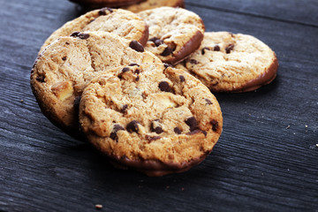 Chocolate cookies on wooden table. Chocolate chip cookies shot on table