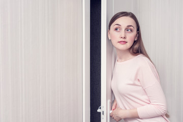 Sly girl was listening outside the door, portrait, copy space, toned