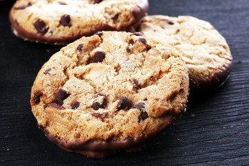 Chocolate cookies on wooden table. Chocolate chip cookies shot on table