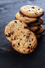 Chocolate cookies on wooden table. Chocolate chip cookies shot on table