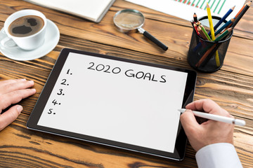 To Do list For New Year 2020, Over Head View Of Work Desk.