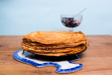 Stack of pancakes with blueberry jam