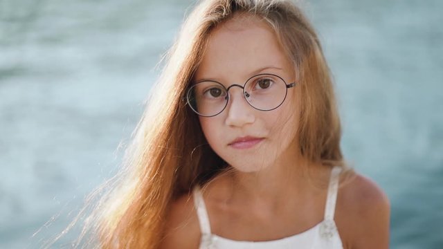 Preteen girl in eyewear looking at camera