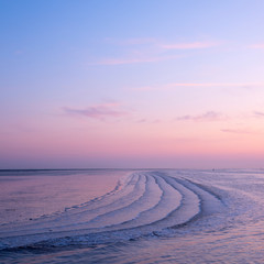 waddenzee or wadd sea during sunset seen from jetty of ameland ferry