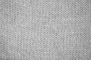 Knitting pattern Knitted seamless background in gray. Knit textures for wallpapers and backgrounds.