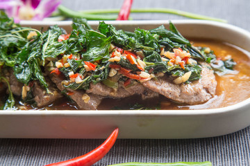 Fried beef basil/Thai spicy food basil beef fried (Krapao Neao)/ Fried beef basil with vegetable on table/