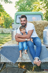 Family on farm.Harvesting Watermelons. Pickup with watermelons.Picnic on farm.Family day. Father and son at ranch.Organic Farming, Food and Vegetable Production.Bio food.Garden produce.Summer vacation